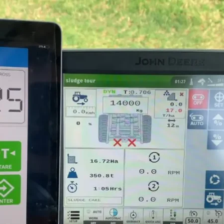 Topcon Cab Control app displaying weight reading of 14025kg on tablet with John Deere tractor terminal in background
