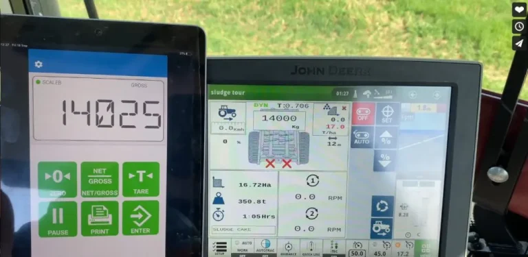 Topcon Cab Control app displaying weight reading of 14025kg on tablet with John Deere tractor terminal in background